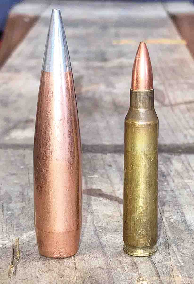 Hornady’s 50-caliber, 750-grain A-MAX (left) – with its 1.05 G1 ballistic coefficient – is a lot of bullet. A fully-loaded 5.56mm/.223 Remington cartridge (right) would neatly fit inside of a hollowed-out .50 BMG bullet.